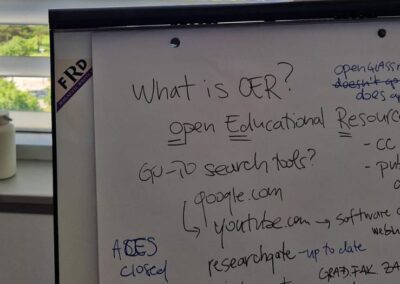 Photo of a whiteboard notes about open educational resources taken during the hands-on workshop on Day 2 of the meeting.